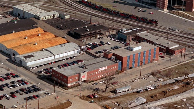 Aerial view of American Air Filter company with Papa John's Cardinal Stadium in background. At right is the constructio on the Central Avenue extension.-

-Caption: BY JAMES H. WALLACE, THE COURIER-JOURNAL
Papa John's Cardinal Stadium dominates the background of this view of the site. The project will be called Central Station.
