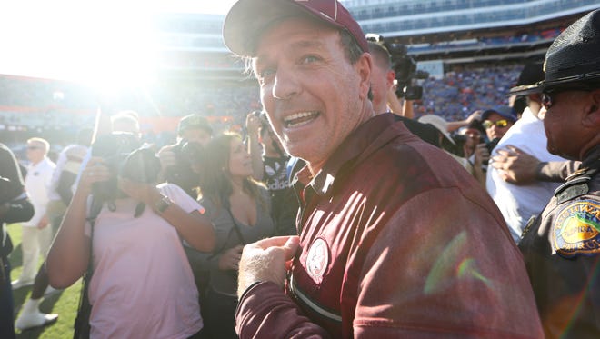 FSU Head Coach Jimbo Fisher smiles after the Seminoles 38-22 win over Florida at Ben Hill Griffin Stadium in Gainesville on Saturday. 