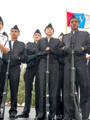 Members of the West High School drill team watch competitors before taking their turn in front of the judges during Friday's Academy Festival at Roane State Community College in Harriman in 2009.