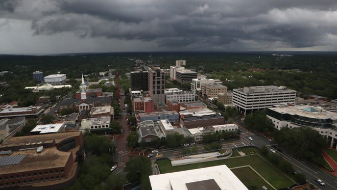 Dark grey clouds hover over downtown Tallahassee Tuesday as the city maintains its rain-soaked status after Subtropical Storm Alberto blew through town.