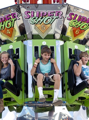 Declan Mahoney, 14, rides the Super Shot on Tuesday. The Tribune gave Mahoney and three other teens each $50 to spend at the Montana State Fair to see how far it went. Mahoney only spent $45 even though his friends promised to help him make “poor decisions.”