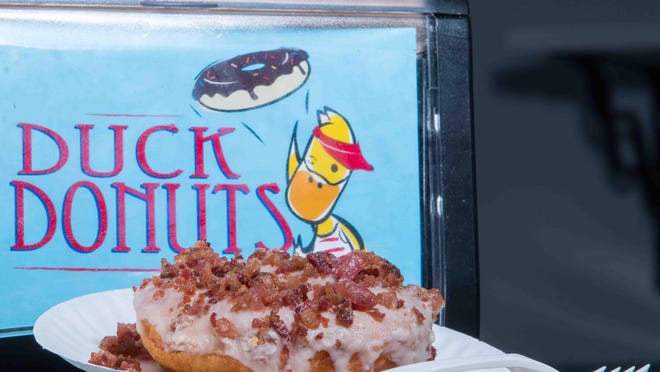 Samples of Duck Donuts famous maple-icing donut topped with bacon pieces at Duck Donuts on East Main Street in Newark.