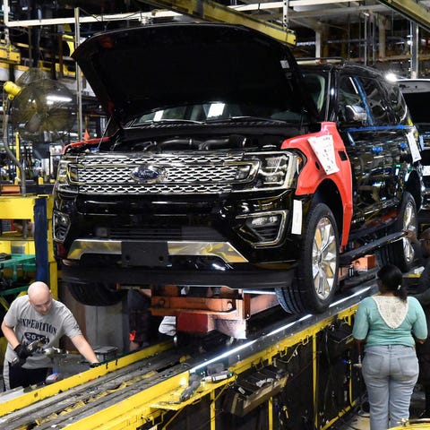 Workers assemble Ford trucks at the Ford Kentucky 