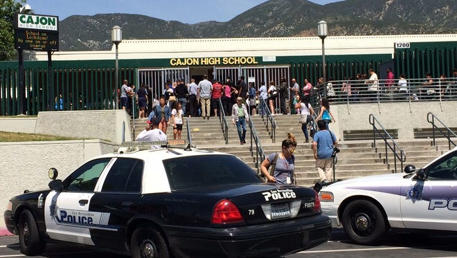 Parents picking up students at Cajon High School in San Bernardino following an apparent murder suicide that injured two students.