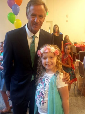 Gov. Bill Haslam with Anaya Bay, 7, who will begin second grade in September for her third year of homeschooling. Anaya spent more than 5,500 minutes reading this summer, making her Jackson's top reader.
