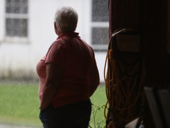Watching a downpour, dairy farmer Kerry Adams said