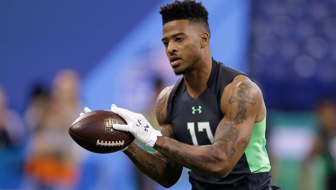Former CSU receiver Rashard Higgins makes a catch during on-field workouts Saturday at the NFL Scouting Combine in Indianapolis.