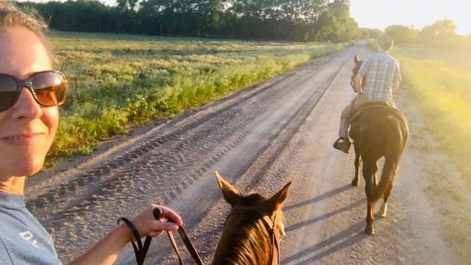 Carmen Weller, left, and her husband, Jason, moved to a small farm near Walton about three years ago. This spring the farrm, christened "Carm's Farm," has gone online with a social media presence and video channel to welcome visitors to the farm.