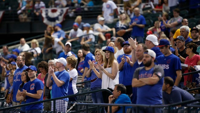 Cubs fans applaud the team as they beat the Diamondbacks 14-6 at Chase Field in Phoenix, Ariz. on Thursday, April 7, 2016. 