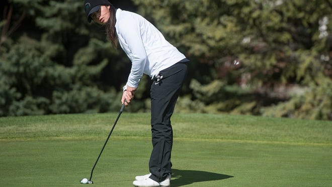 Fossil Ridge High School's Leigha Devine lines up a putt during a tournament last year at SouthRidge Golf Course. The Fossil Ridge and Rocky Mountain girls golf teams are both scheduled to participate in the Front Range League Championships on Wednesday at Collindale Golf Course, beginning at 9 a.m.