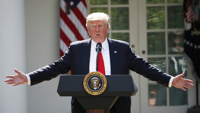 President Donald Trump speaks about the U.S. role in the Paris climate change accord, on June 1 in the Rose Garden of the White House in Washington.