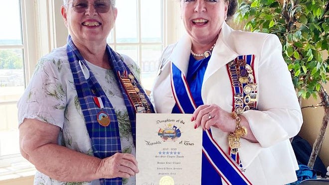 Bosque River Chapter President Judith D'Amico (left)accepts the sixth consecutive Six Star award from Daughters of the Republic of Texas President General Carolyn Raney during the District 2 meeting held Aug. 29 in Eastland.