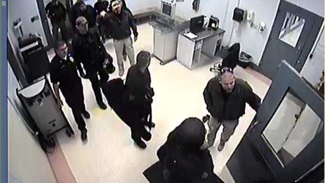 Officers from the Dona Ana County Detention Center and Southern New Mexico Correctional Facility file into the county jail during a temporary takeover on Dec. 8.