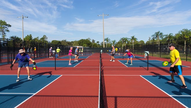 Ed Nulton, 82, left, hits the ball during a pick-up pickleball game on the courts at East Naples Community Park on Wednesday, Sept. 7, 2016 in Naples, Florida. Due to last years success, organizers want to extend the contract to host the US Open Pickleball Championships in Collier County for another five years.