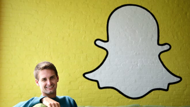 In this Thursday, Oct. 24, 2013, file photo, Snapchat CEO Evan Spiegel poses for a photo in Los Angeles.
