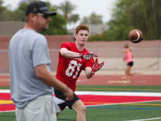 Chaparral High WR Tommy Christakos makes a catch while