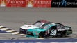 Denny Hamlin (20) edges out William Byron at the checkered