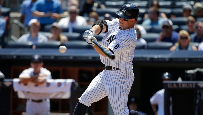 New York Yankees' Brett Gardner hits a single during the first inning of a baseball game against the Minnesota Twins Saturday, June 25, 2016, in New York.