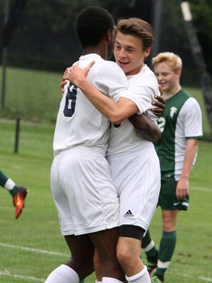 Cranbrook Kingswood's athletic teams, like the boys soccer team celebrating a goal in a recent game, will now have the opportunity to compete for  a Catholic League tournament title.