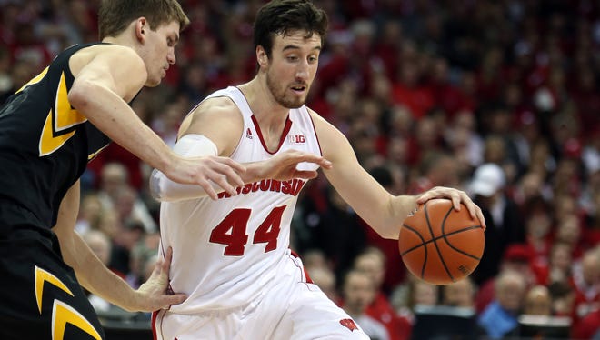 Frank Kaminsky, right, and Adam Woodbury battle during Tuesday's game.