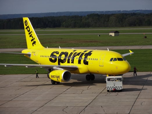 Spirit's first aircraft to get the airline's new paint scheme is rolled outside for photographs  at the Premier Aviation Overhaul Center in Rome, N.Y., on Sept. 15, 2014.