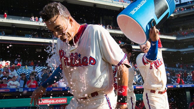 Phillies right fielder Aaron Altherr (23) is doused with Powerade by shortstop J.P. Crawford (2) after hitting a walk off RBI single during the eleventh inning against the Pittsburgh Pirates at Citizens Bank Park.
