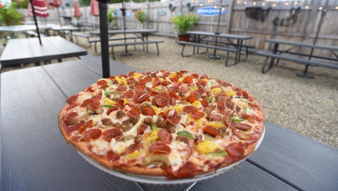 The Six Alarm Pizza is one of Firehouse Pizza's most popular offerings. The restaurant is in downtown Thornville, and also features a patio.