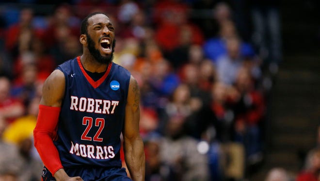 Robert Morris Colonials guard Lucky Jones (22) celebrates during the second half against the North Florida Ospreys in the first round of the 2015 NCAA Tournament at UD Arena.