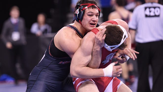 Wrestling State Championships, Round of 16, at Boardwalk Hall in Atlantic City on Friday, March 3, 2017. (left) Shane Sosinsky, of Northern Highlands, battles Vince DeGeorge, of Delsea, in their 182 pound match. 