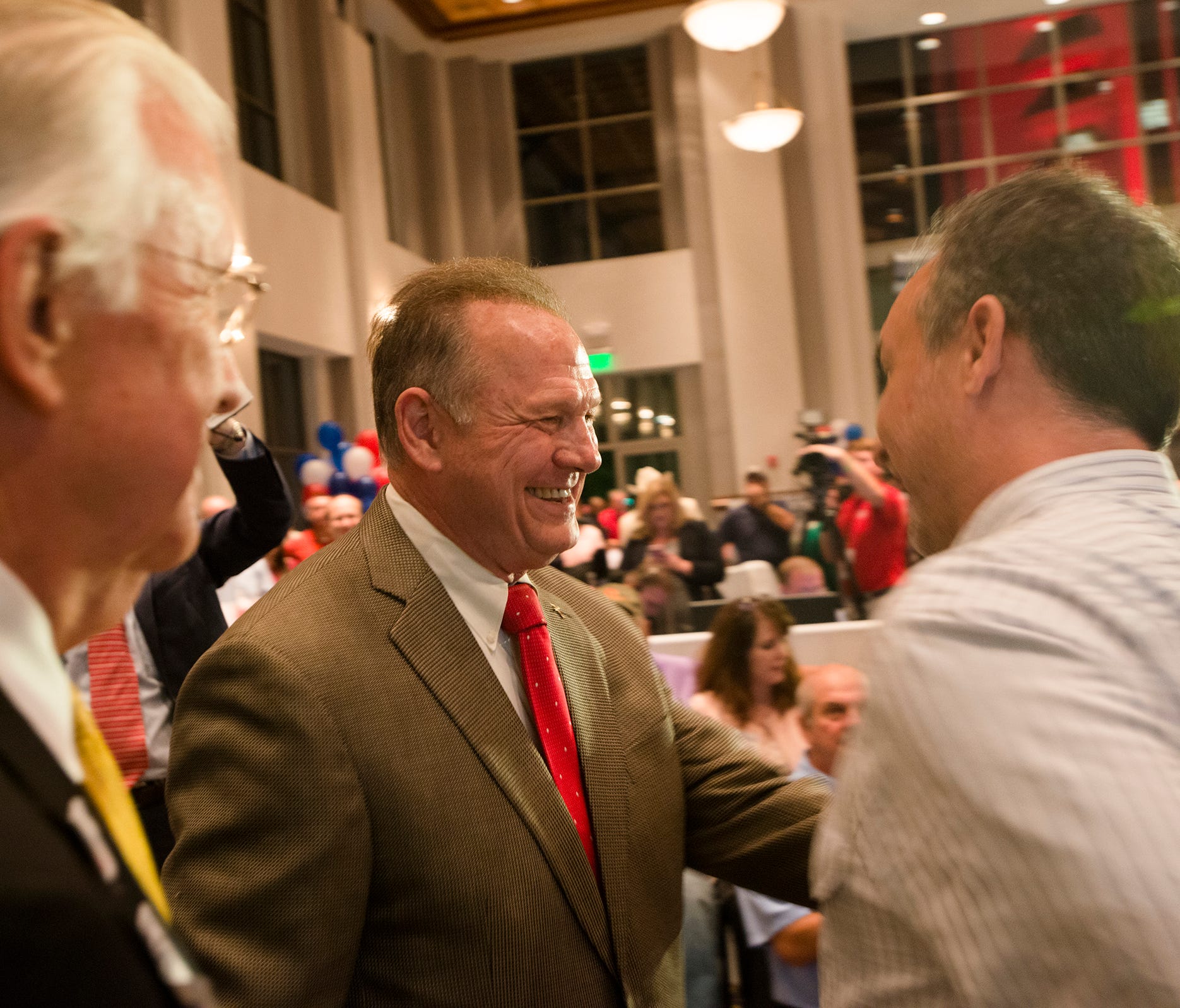 Roy Moore greets supporters during the Roy Moore for Senate election party on Tuesday, Sept. 26, 2017, in Montgomery, Ala.