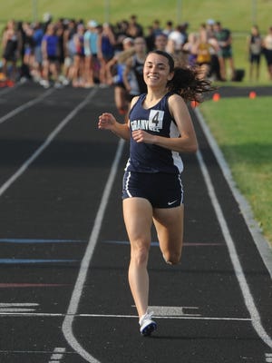 Granville senior Micaela DeGenero smiles after winning the 1,600 this past Friday during the Division I regional meet at Pickerington North.