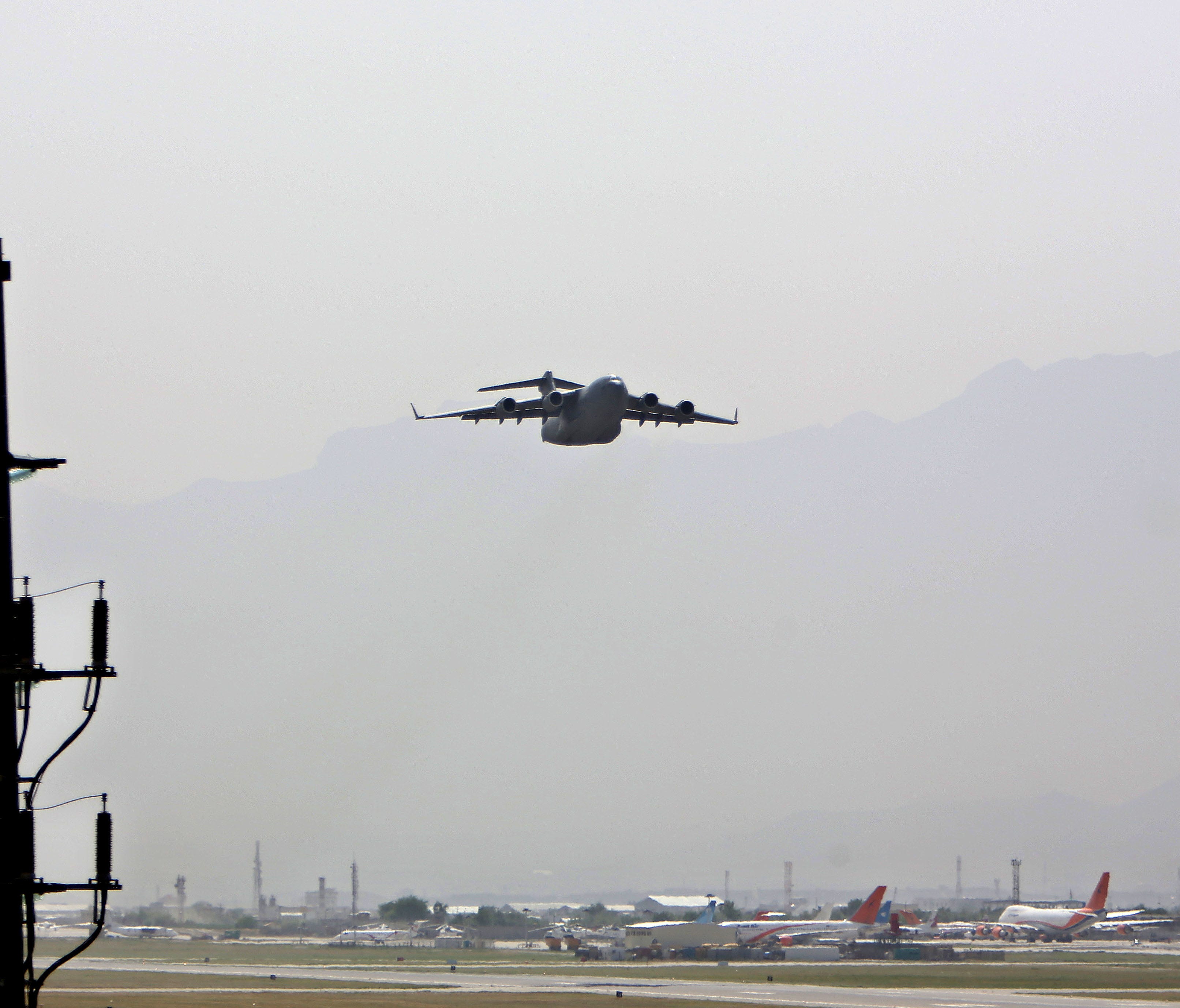 In this Tuesday, May 5, 2015 photo, an aircraft takes off at the Hamid Karzai International Airport in Kabul, Afghanistan.