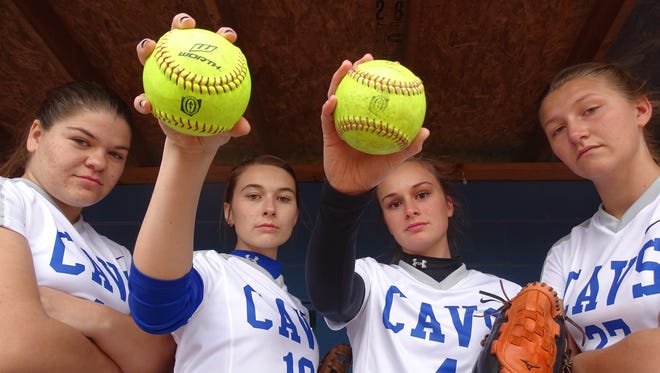 (From left to right): Haylee Jo Large, Olivia Ray, Tori Bettendorf, and Sydney Gallaugher stand in their home dugout at Mount Logan Elementary School. The Cavaliers started playing in their own facility in 2011, after never having a home field.