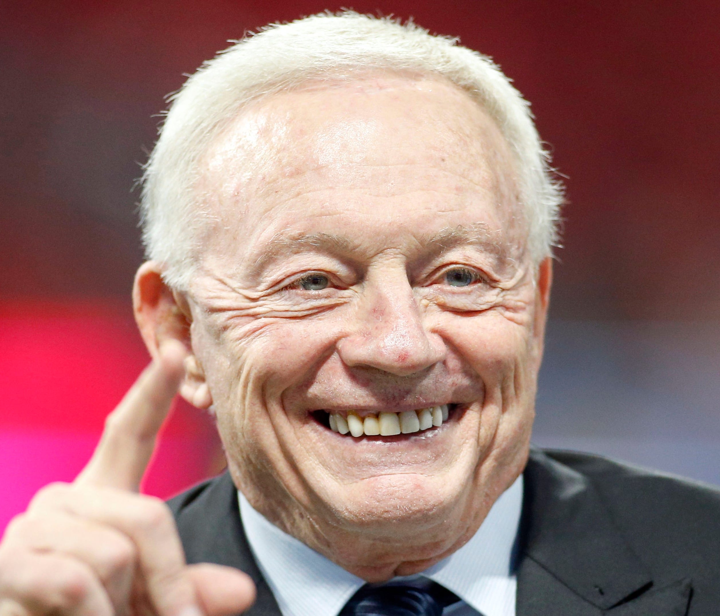 Dallas Cowboys owner Jerry Jones' smile belies his anger toward NFL commissioner Roger Goodell and Atlanta Falcons owner Arthur Blank, before Sunday's game in Atlanta.