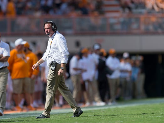 Tennessee Head Coach Butch Jones walks off the field