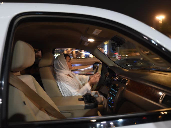 Saudi Samar Al-Moqren drives her car through the streets