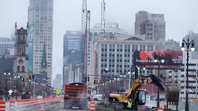 Construction continues on Woodward Ave for the M1-line, Tuesday, March 31, 2015. Lane changes and street closures will be the norm throughout the spring and summer months during the construction period. Diane Weiss/Detroit Free Press 