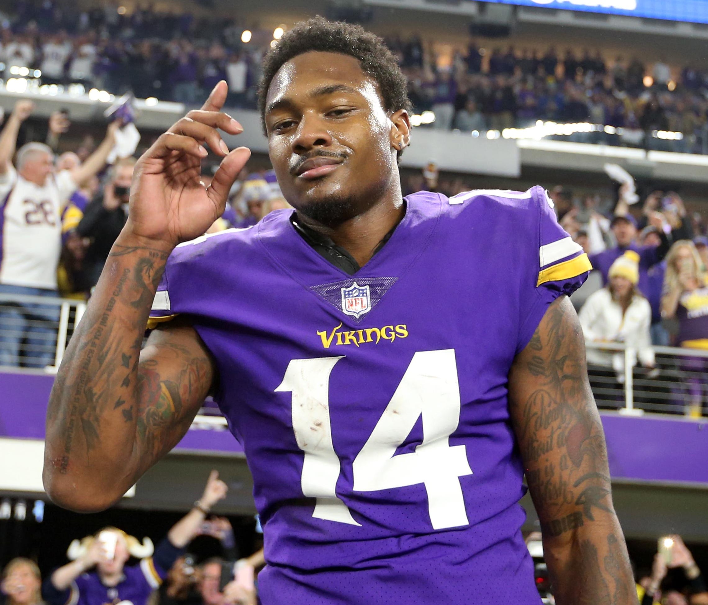 Minnesota Vikings wide receiver Stefon Diggs (14) celebrates after the NFC Divisional Playoff football game against the New Orleans Saints at U.S. Bank Stadium.