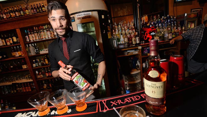 Sam Thomas, bartender at The Korner Lounge, has got your order when it comes to the best liquor for your drink.