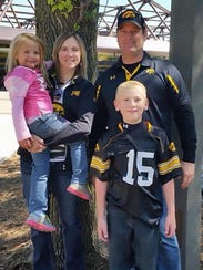 Adrianna, left; Amy; Kevin; and Sterling Sharp, front,