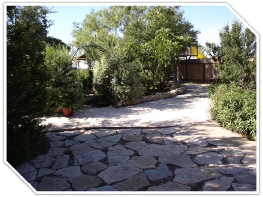 The Flanagan xeriscape yard features natural resources