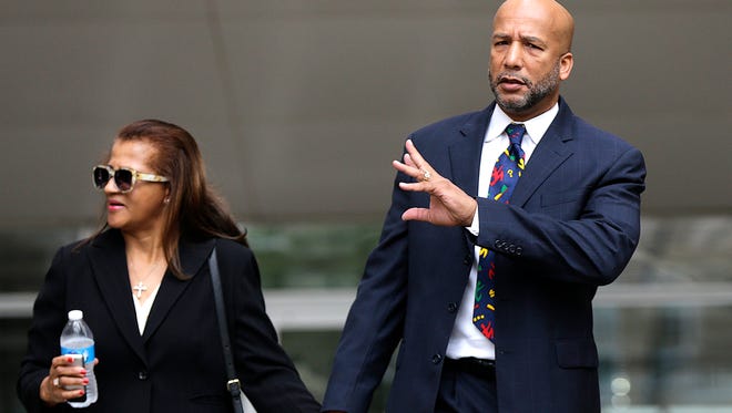 Former New Orleans Mayor Ray Nagin leaves federal court in New Orleans with his wife, Seletha Nagin, on July 9, 2014, after being sentenced to 10 years in prison for bribery, money laundering and other corruption that spanned his two terms as mayor.