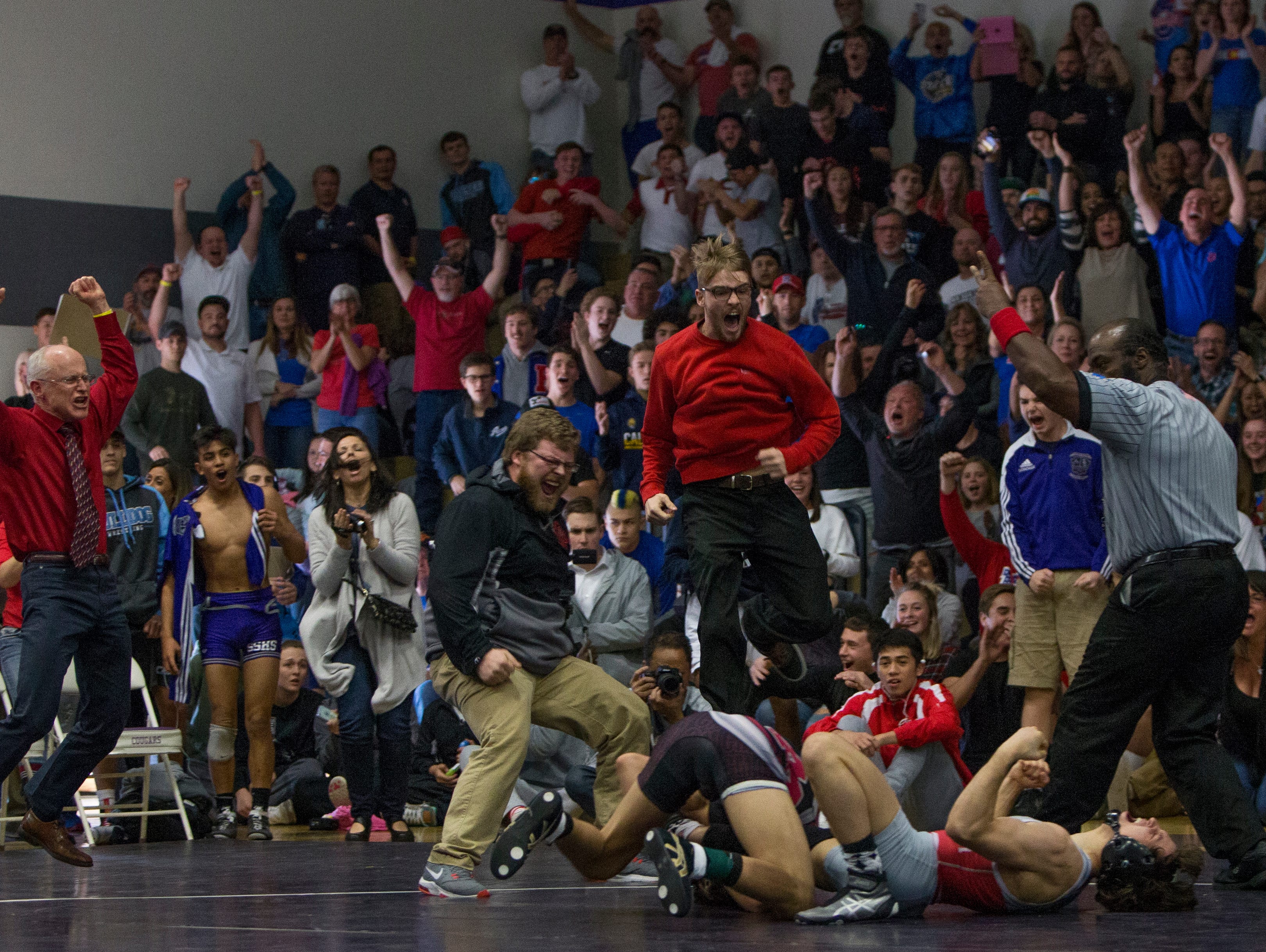 Wooster's Ian Timmins reacts laying on his back on the mat, as his coaches and fans celebrate, after defeating Cimarron's Daniel Rodriguez in the 126-pound division of the 4A Nevada State Wrestling Championships held on Saturday at Spanish Springs. Timmins won the State Championship.