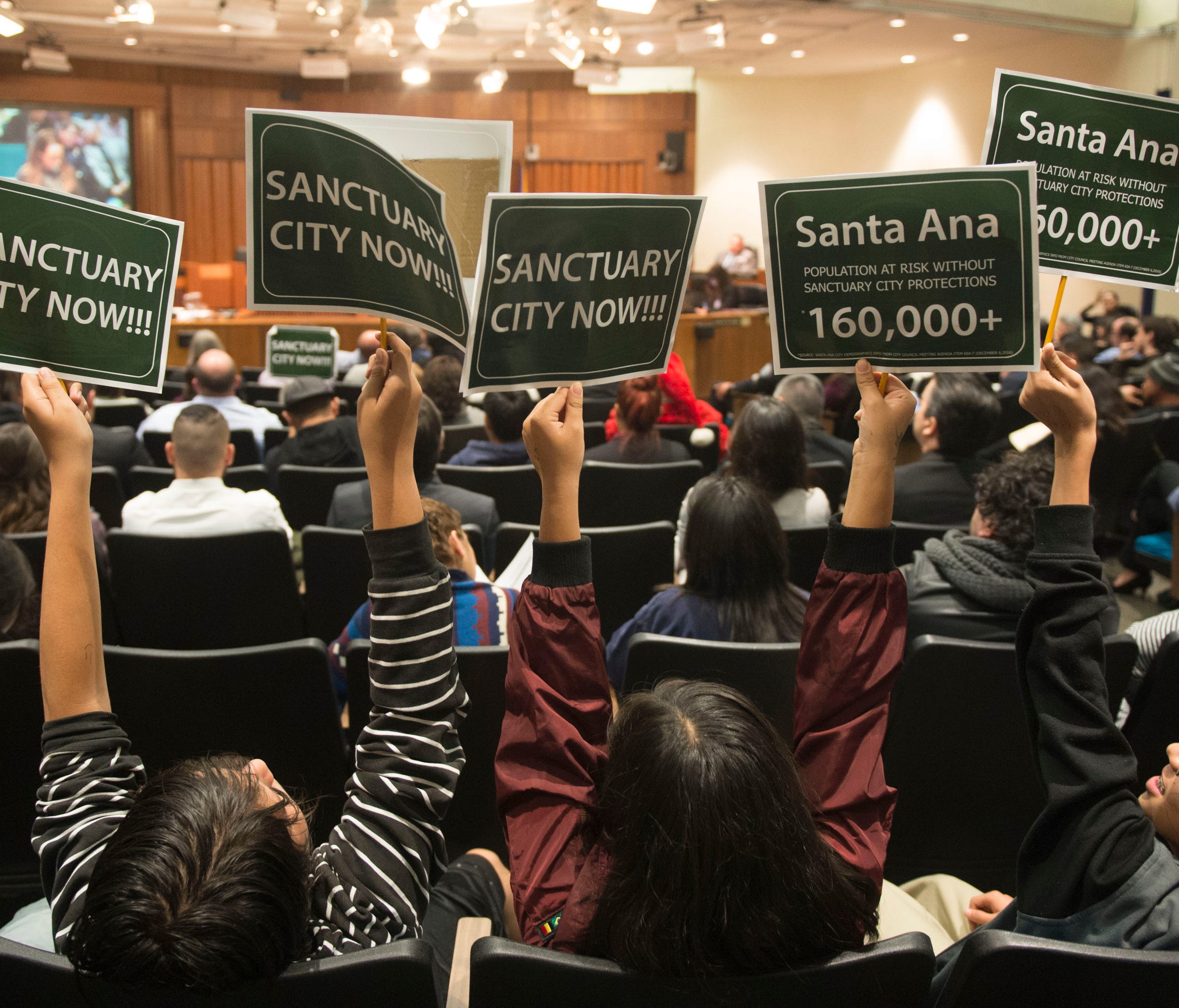 Students show their support for a proposed ordinance declaring Santa Ana, Calif, a sanctuary for all residents regardless of immigration status during a city council meeting Dec. 20, 2016.