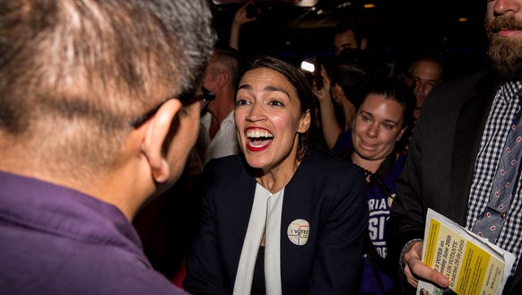 Progressive challenger Alexandria Ocasio-Cortez celebrates with supporters at a victory party in the Bronx after upsetting incumbent Democratic Rep. Joseph Crowley on June 26, 2018, in New York City.