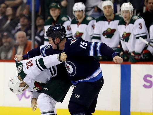 Nov. 27: Minnesota Wild's Daniel Winnik (26) and Winnipeg