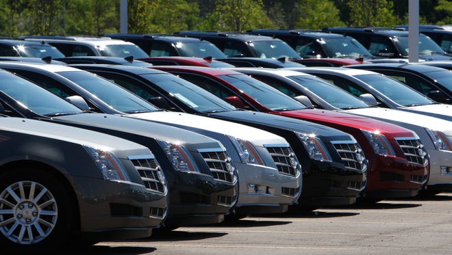 File-This July 14, 2010, file photo shows Cadillac CTS vehicles being displayed outside the LaFountaine Cadillac in Highland Township, Mich.  General Motors safety crisis worsened on Monday, June 30, 2014, when the automaker added 8.2 million vehicles to its huge list of cars recalled over faulty ignition switches. The latest recalls cover seven vehicles, including the Chevrolet Malibu from 1997 to 2005 and the Pontiac Grand Prix from 2004 to 2008. The recalls also cover a newer model, the 2003-2014 Cadillac CTS. GM said the recalls are for unintended ignition key rotation. (AP Photo/Carlos Osorio, File)