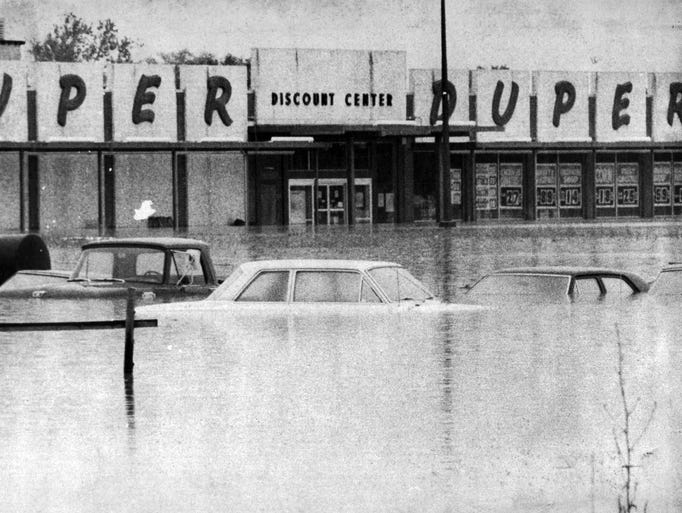 Genesee flood waters rise over cars left in parking