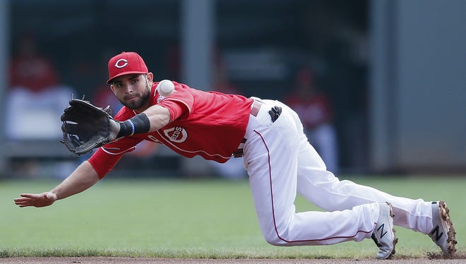 Reds second baseman Jose Peraza dives to catch a soft line drive Aug. 22 against the Los Angeles Dodgers.