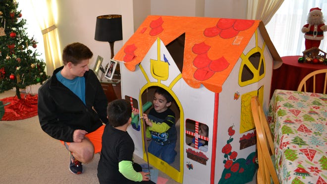 LVC Habitat for Humanity chapter recently delivered playhouses to Habitat homeowner Liz Cruz of Lebanon and her children. Pictured are chapter
President David Corvino  and Reyel Morale and Devin Morales.